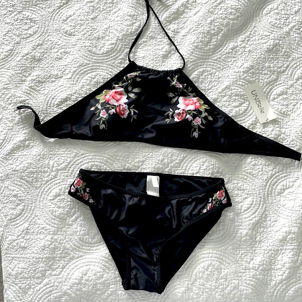 New authentic bathing suit in black with flowers. Size Large. Runs for size 6-8
